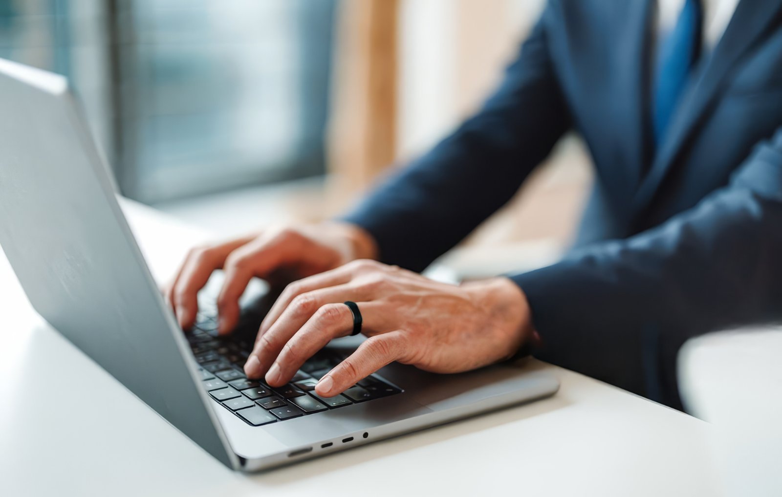 Person wearing SOVA ring while working